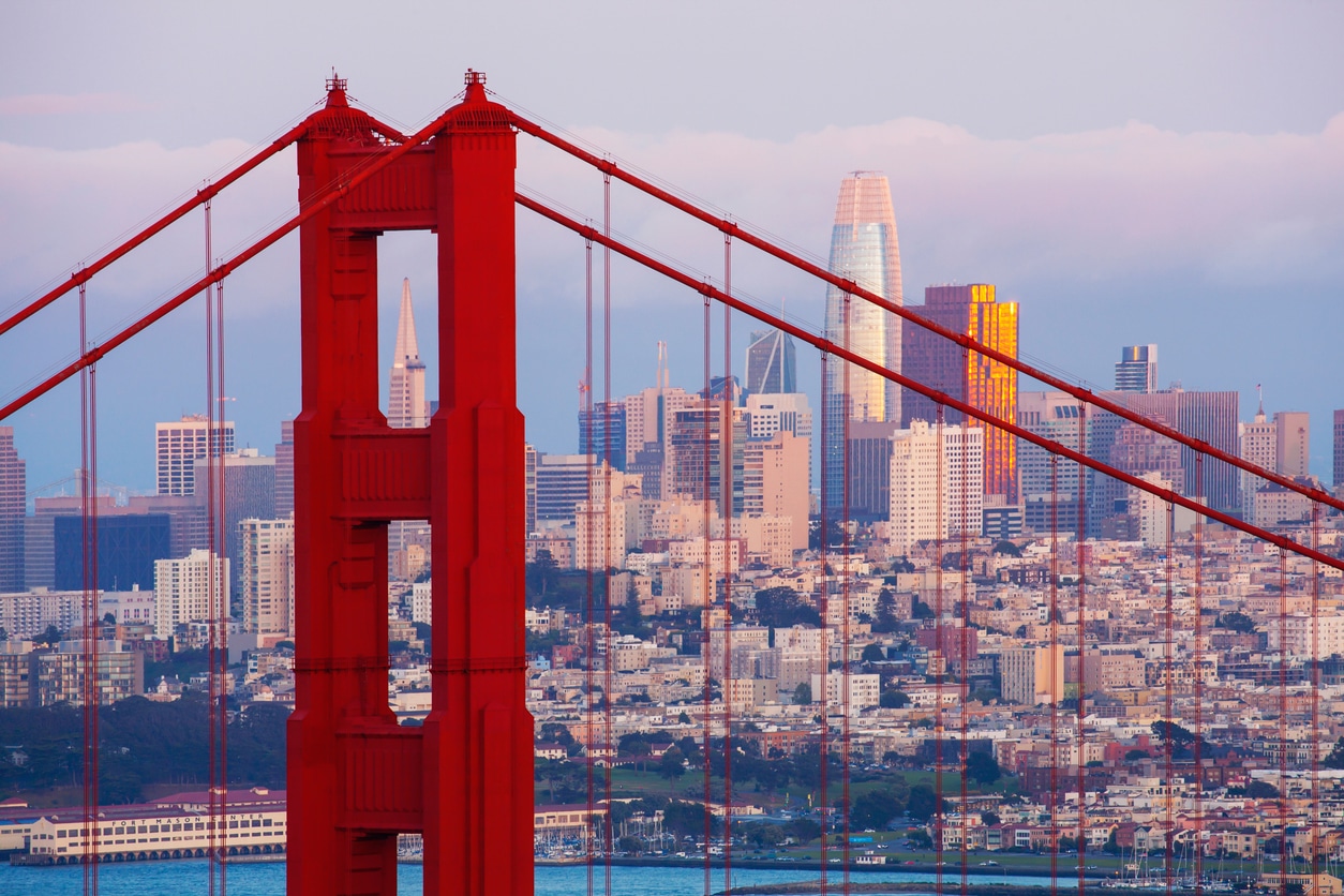 A picture of the San Francisco skyline seen through the Golden Gate Bridge on a hot, hazy late afternoon.