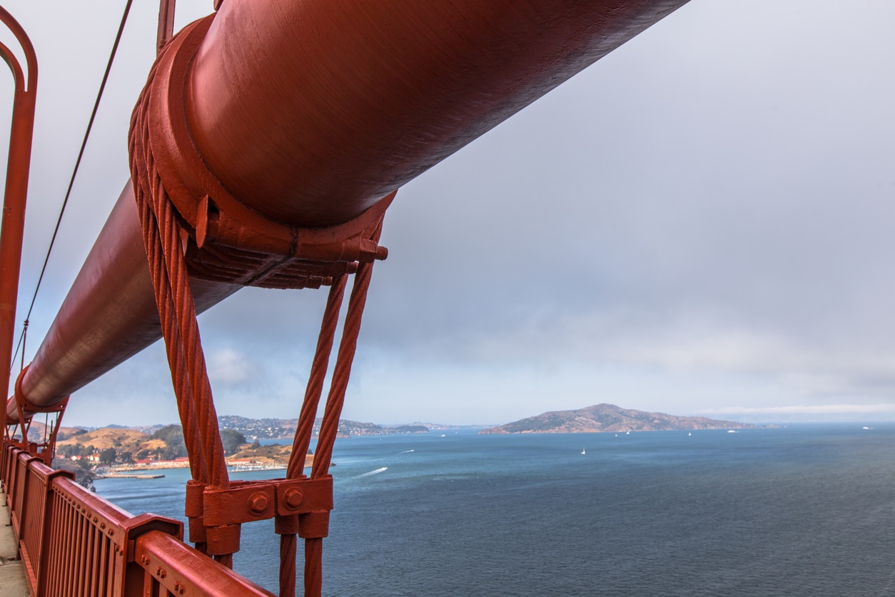 An image of San Francisco Bay from the Golden Gate Bridge, on a foggy day.